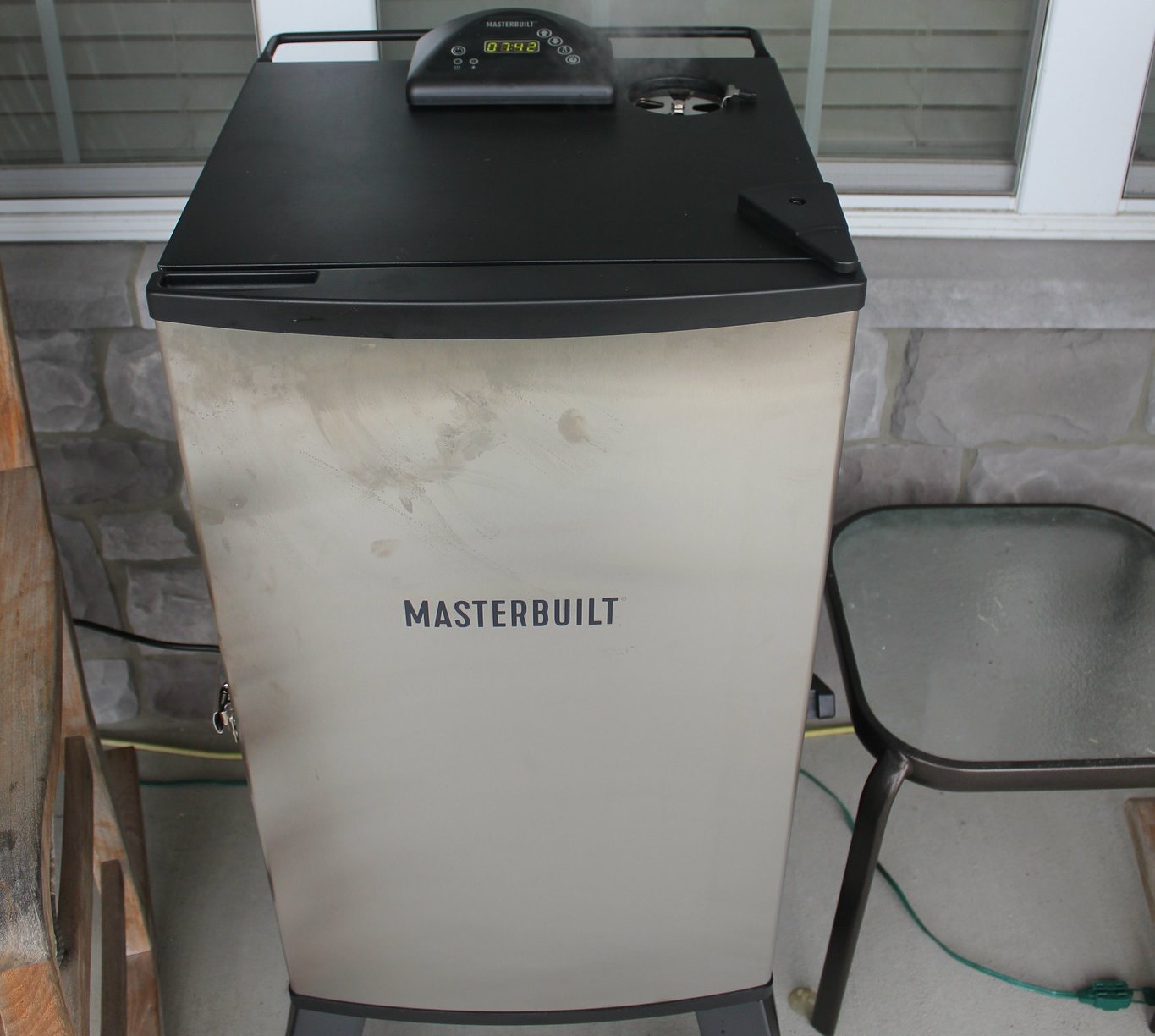 Close Up Photo of Electric Smoker placed near window