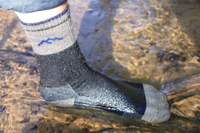 Close Up Photo of Hiking Socks in water