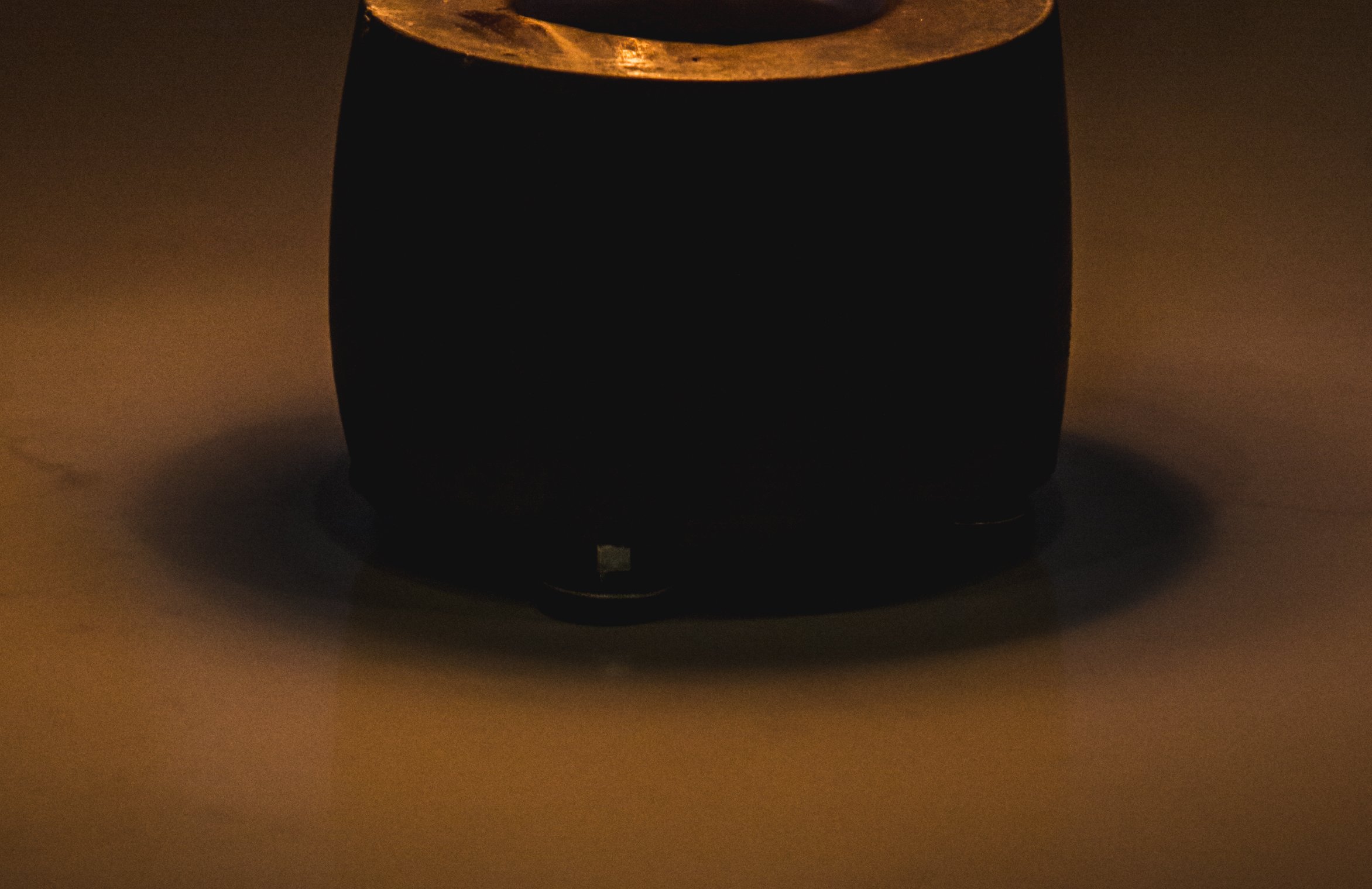 Close Up Photo of Tiny Round Tabletop Fire Pit placed on a table