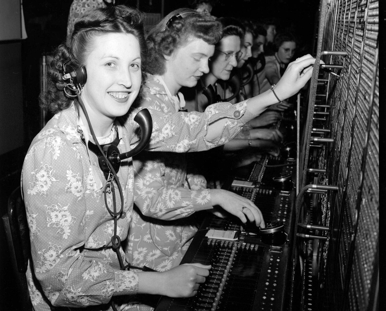 Grayscale Photo of Telephone Operators in their workplace.