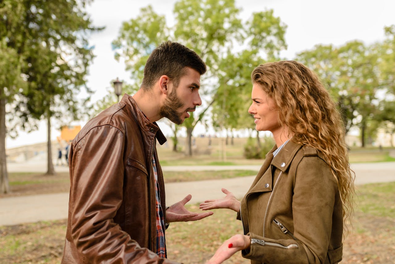 Portrait Photo of Man And Woman talking to each other