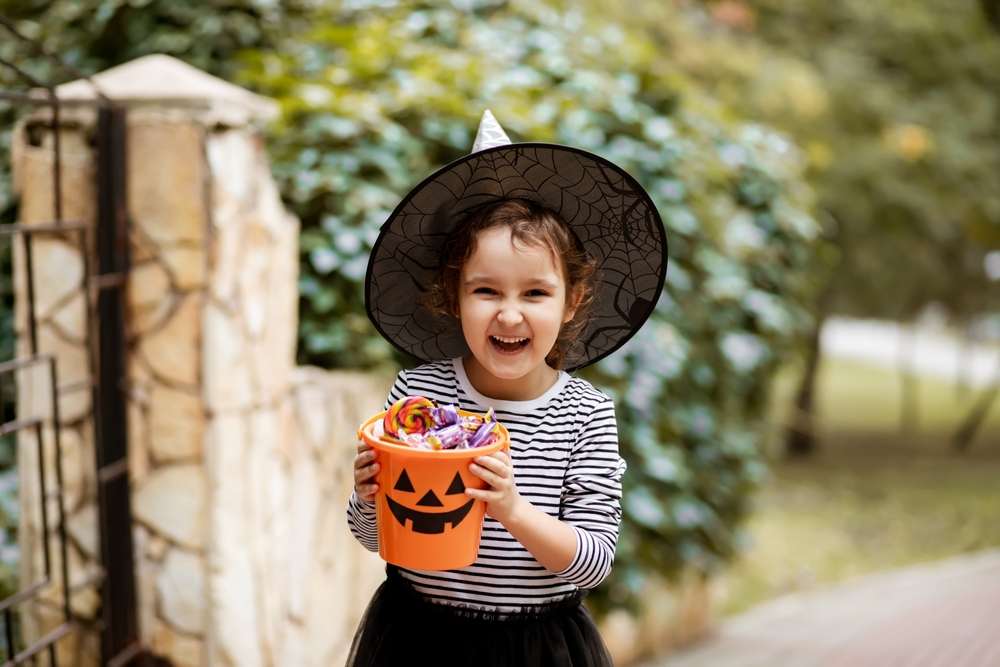 Girl holding Halloween candy