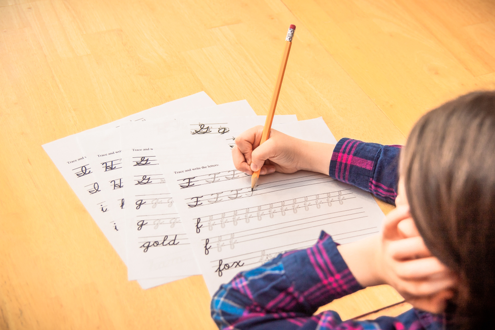 Child practicing cursive writing