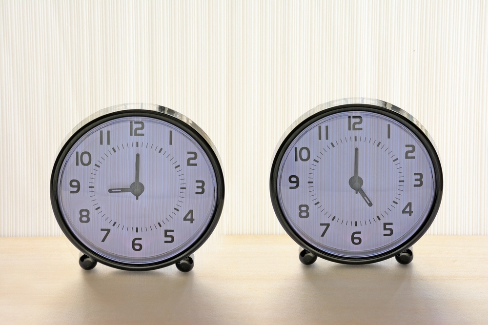 two clocks showning 5 to 9 time