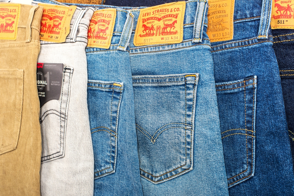 Row of multi-colored branded pants