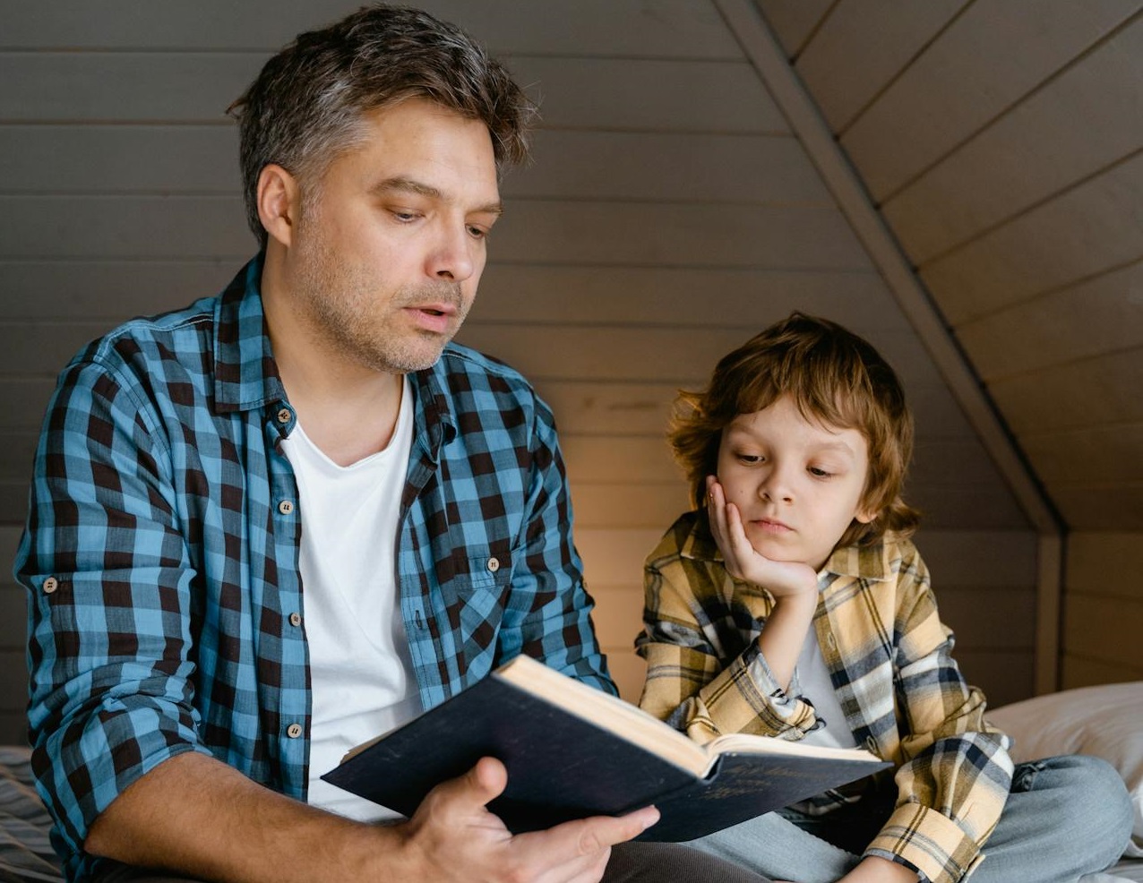 A Father Reading a Book to His Son