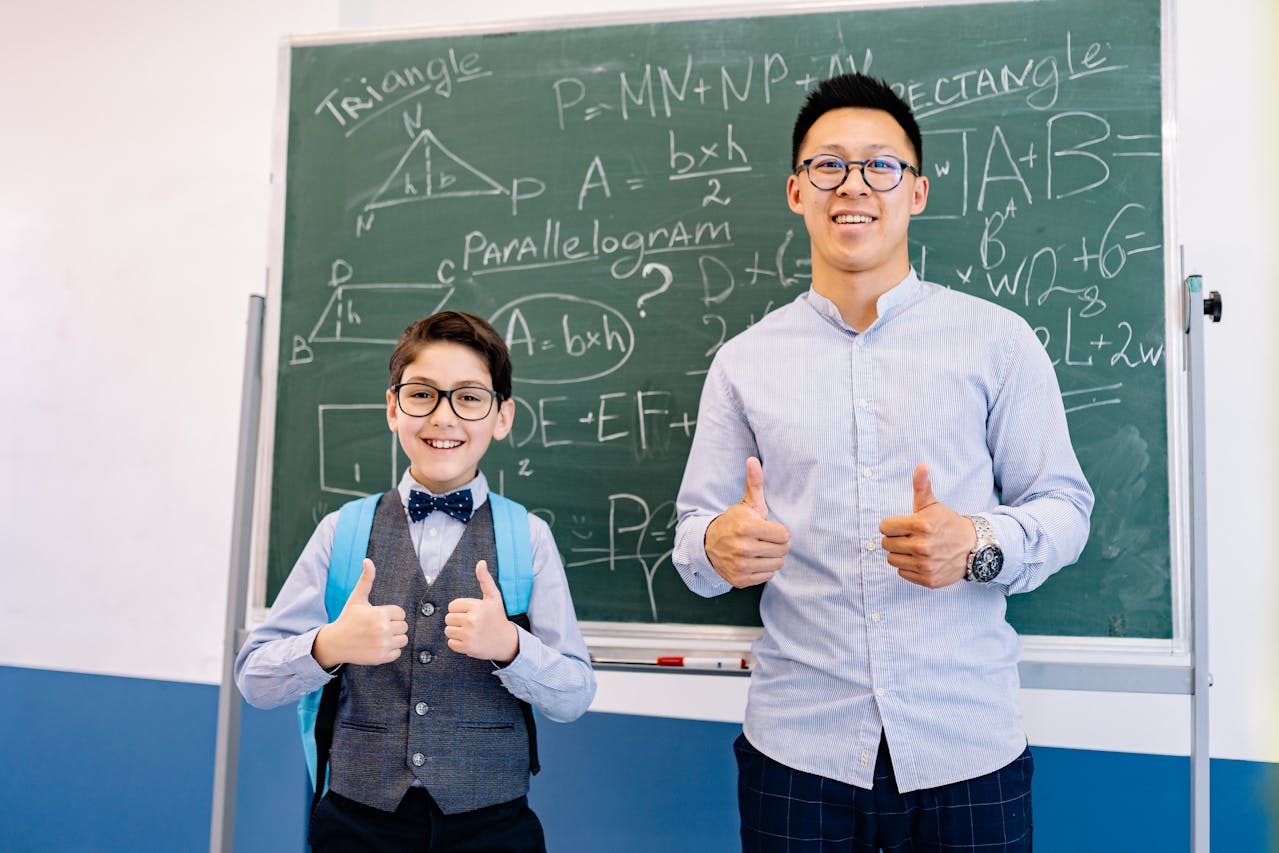 A Teacher and a Student Doing a Thumbs up.
