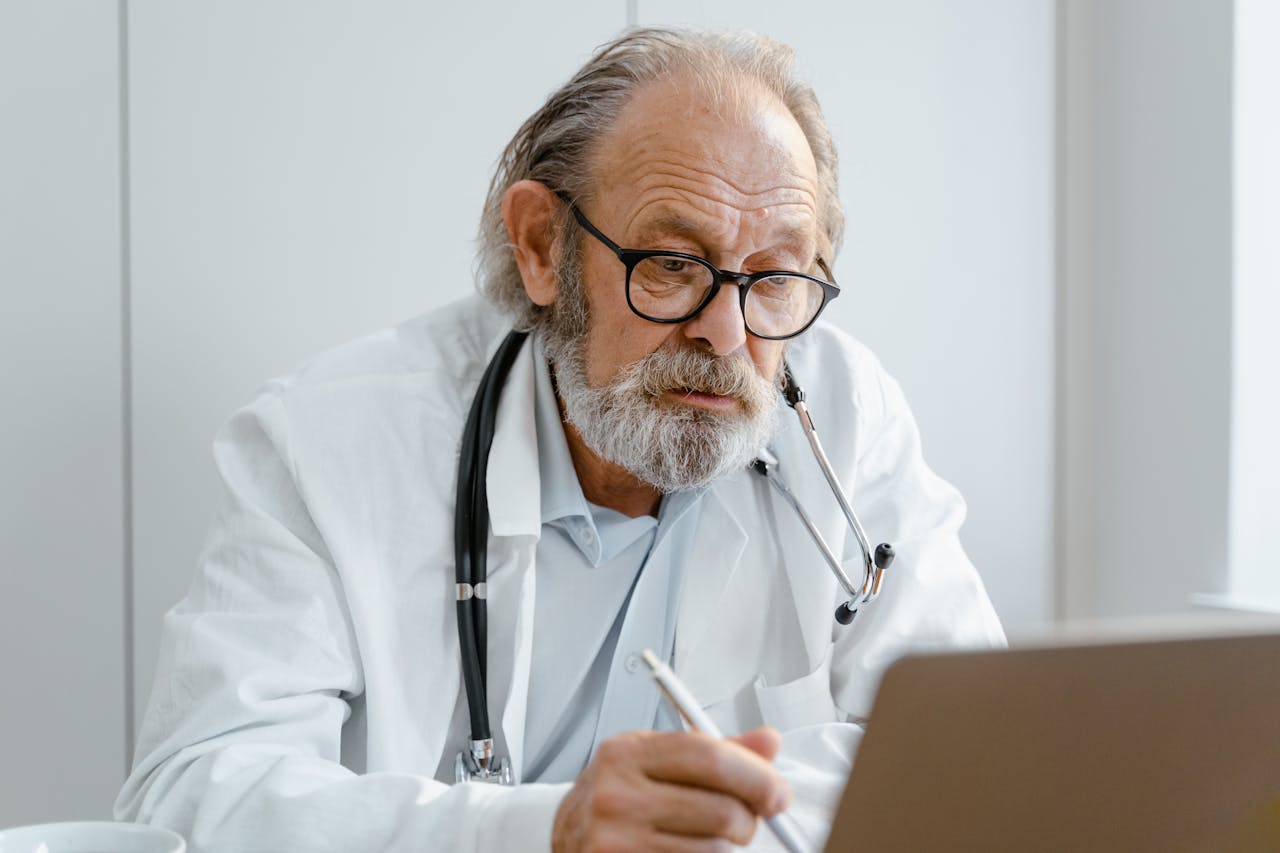 Portrait Photo of A Doctor Wearing Eyeglasses