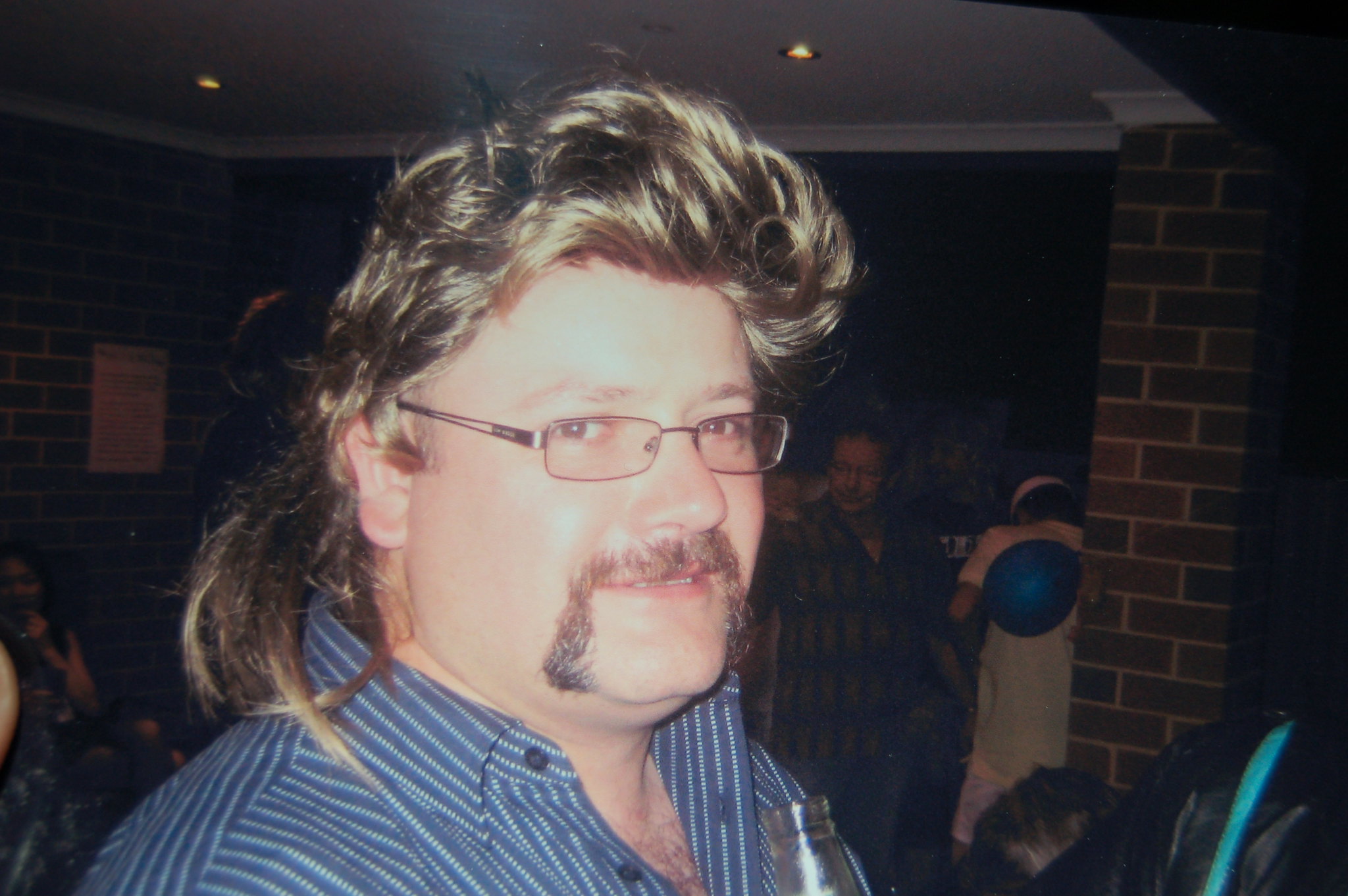 Man with mullet haircut.