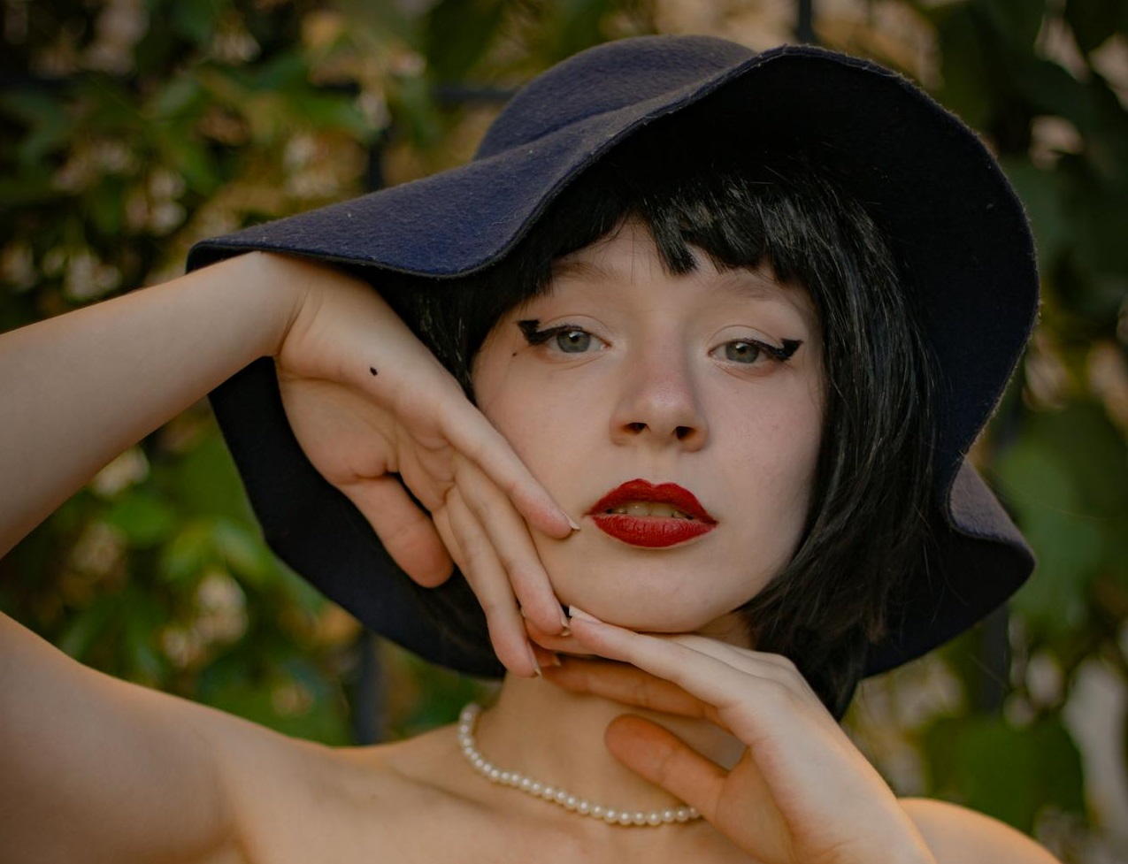 Young Woman in a Black Floppy Hat.