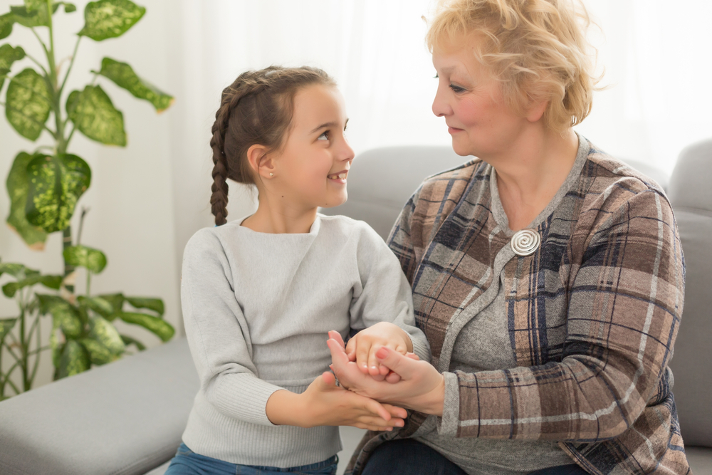 Little granddaughter and happy grandmother