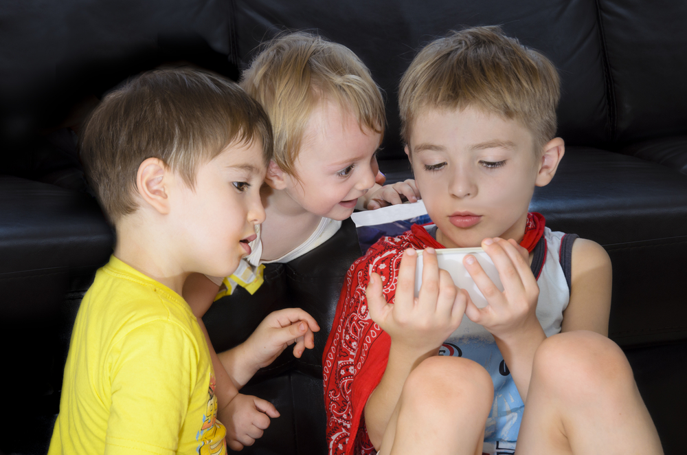 kids playing with a smart phone