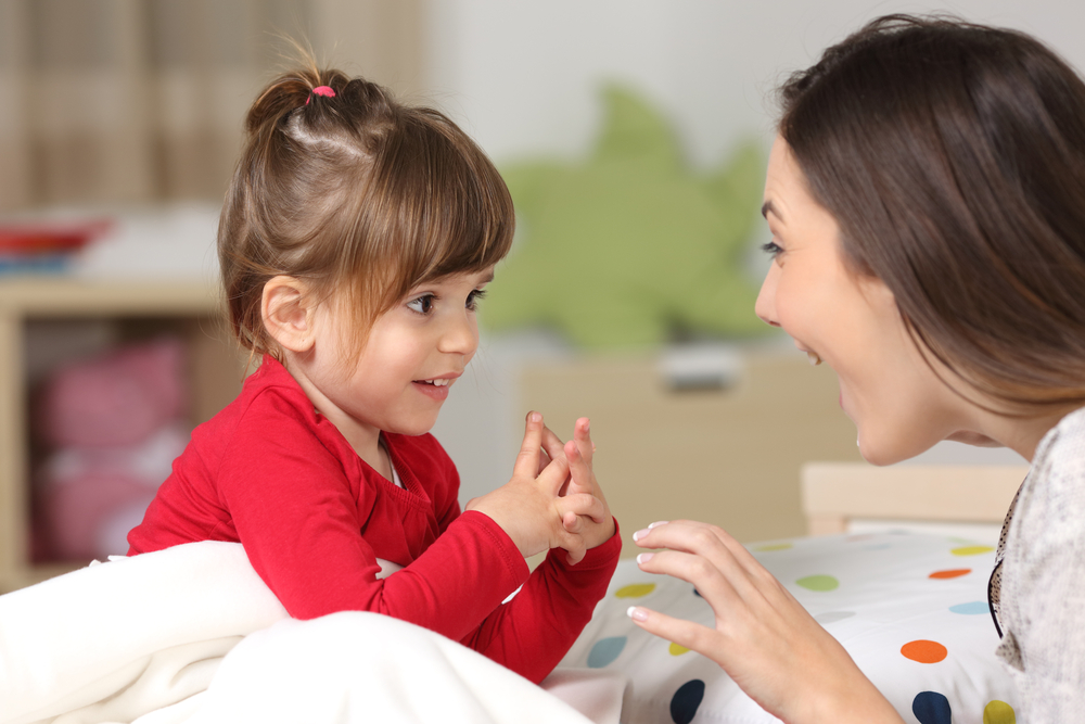 Mother and toddler wearing red shirt