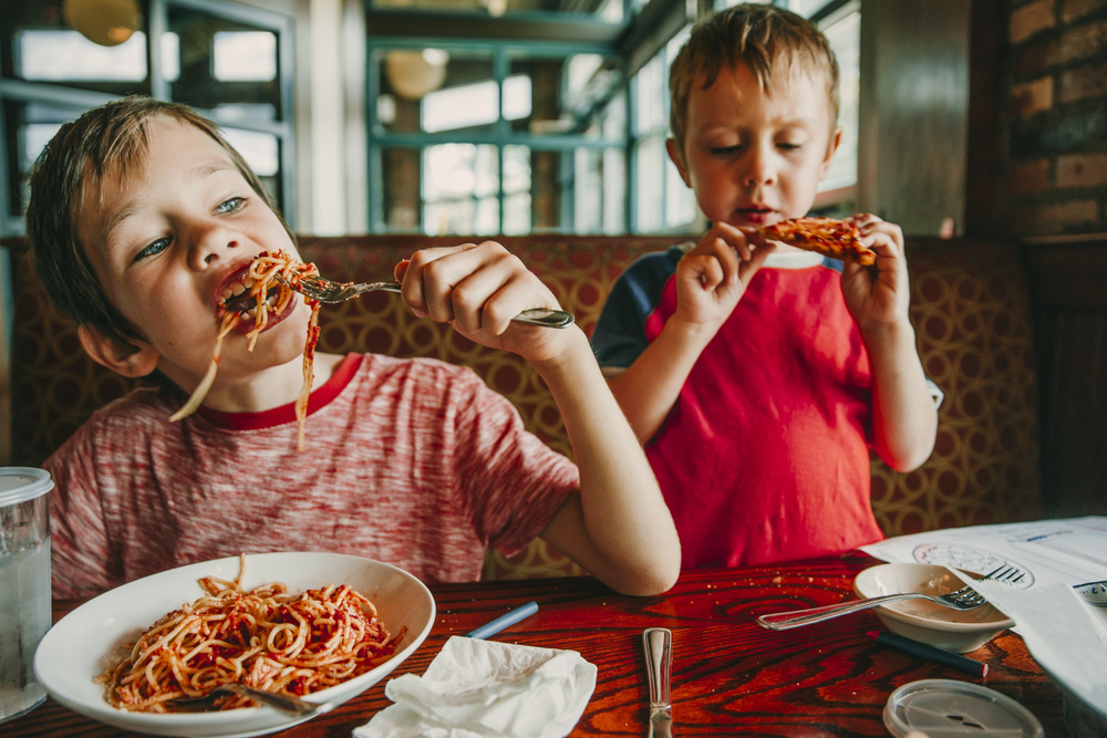 children eat unhealthy food in a cafe
