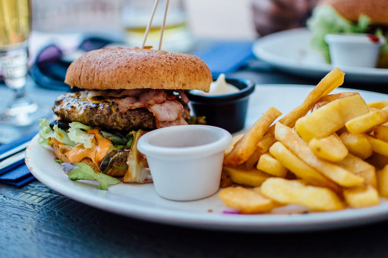 Close Up Photo of Fries and Burger on White Plate