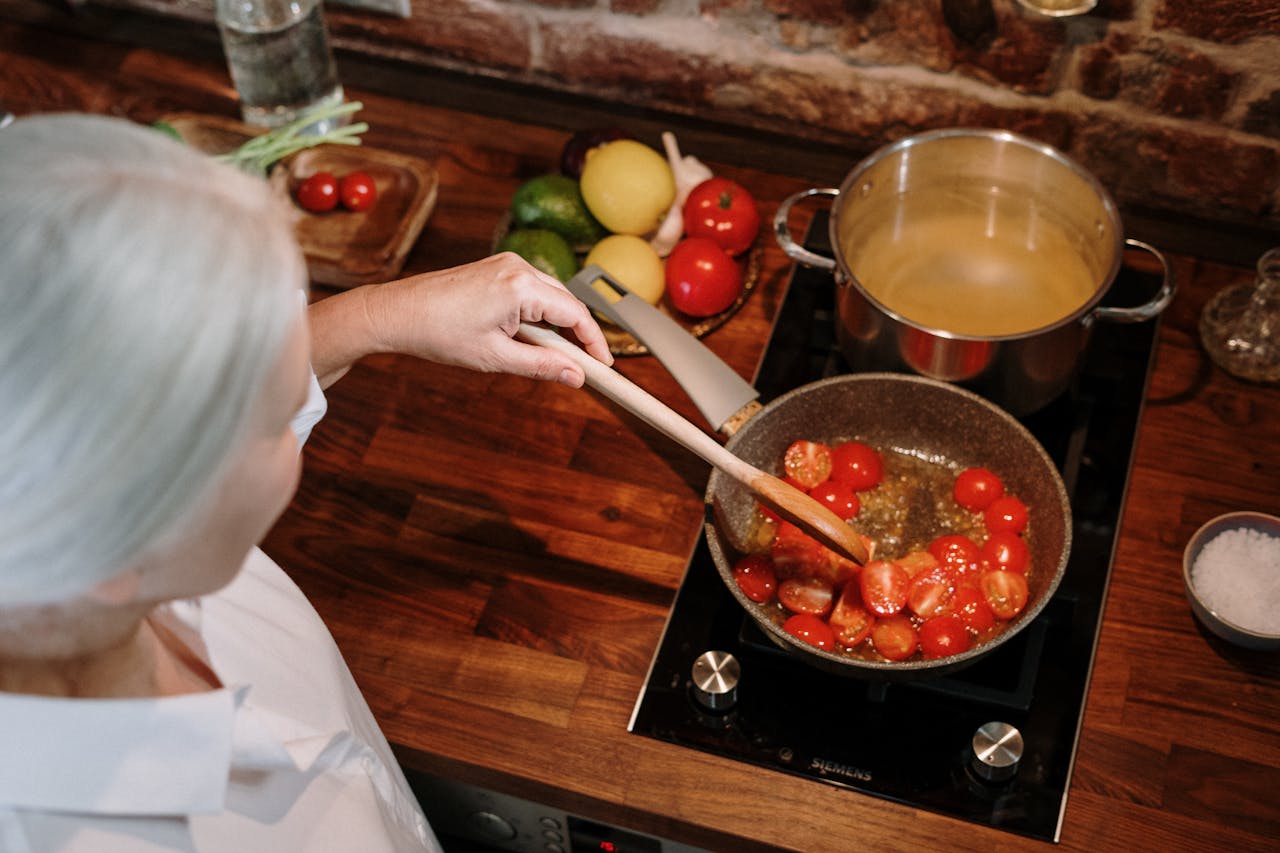 Overhead photo of a woman preparing meal at home.