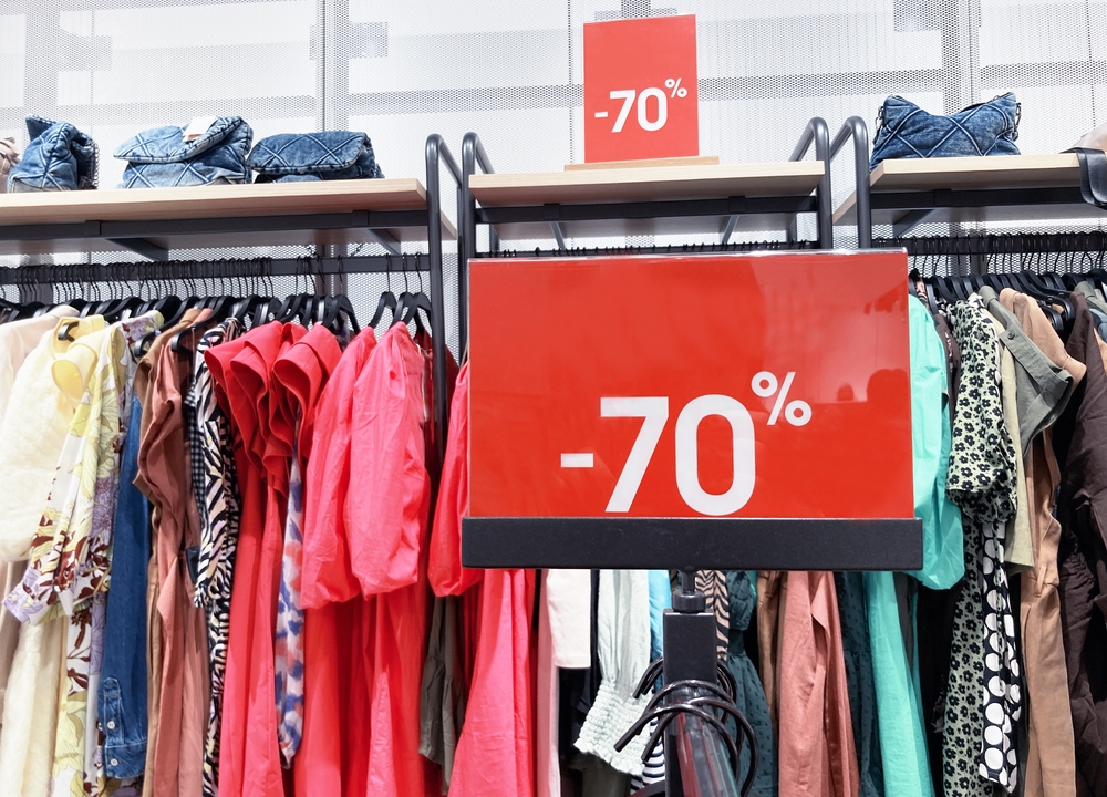 Red stand with big 70 percent discount price in shopping center