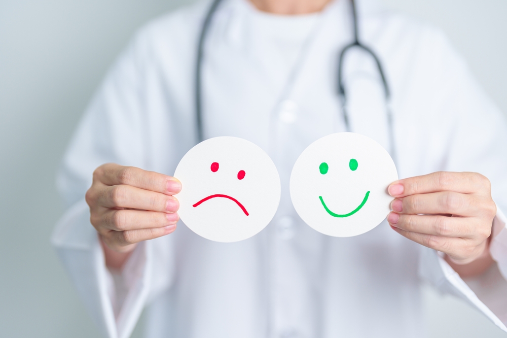 Doctor show Happy smile and Unhappy Sad face