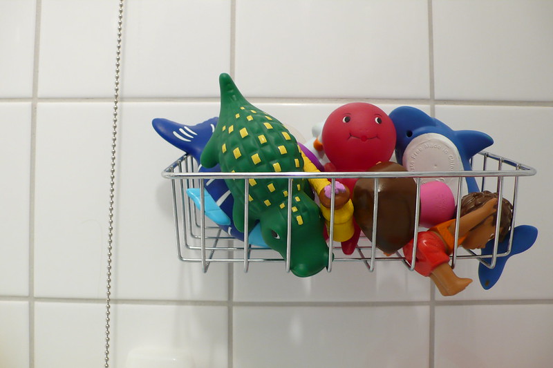 Close Up Photo of Bath Toys placed on a metal rack