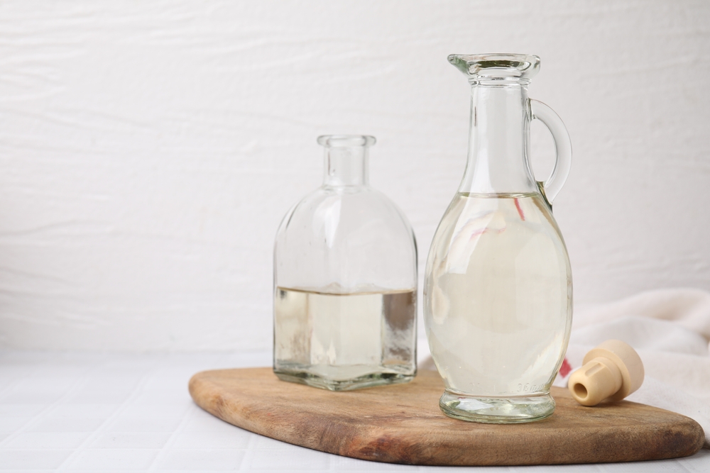 Close Up Photo of Vinegar in glass jug and bottle