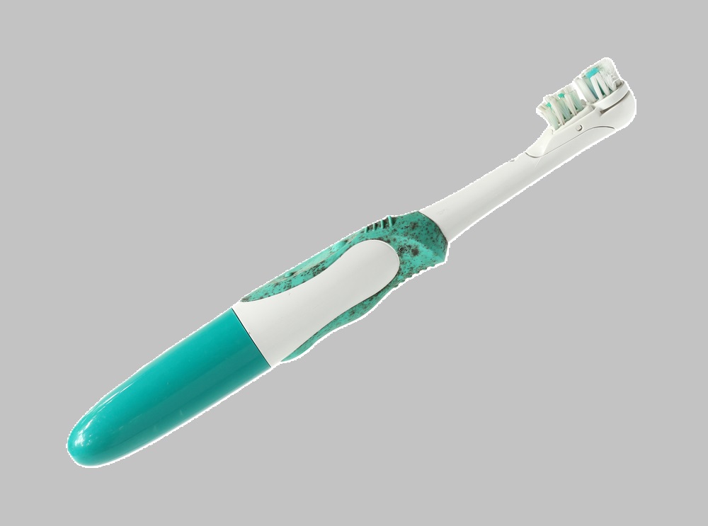 Old Electric toothbrush isolated on white background