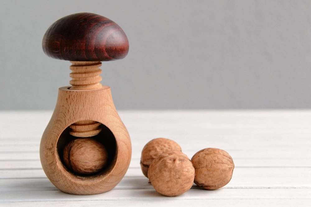 Wooden nutcracker in a shape of mushroom.