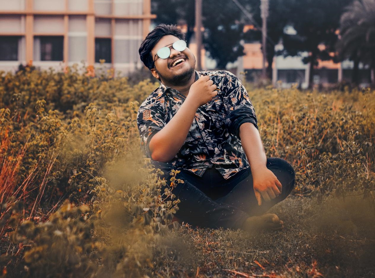 Man Sitting on Grass