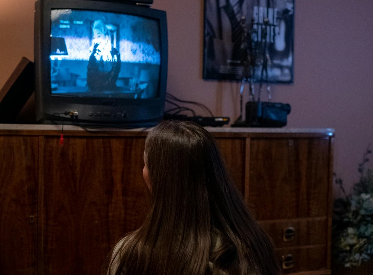 Young girl watching TV
