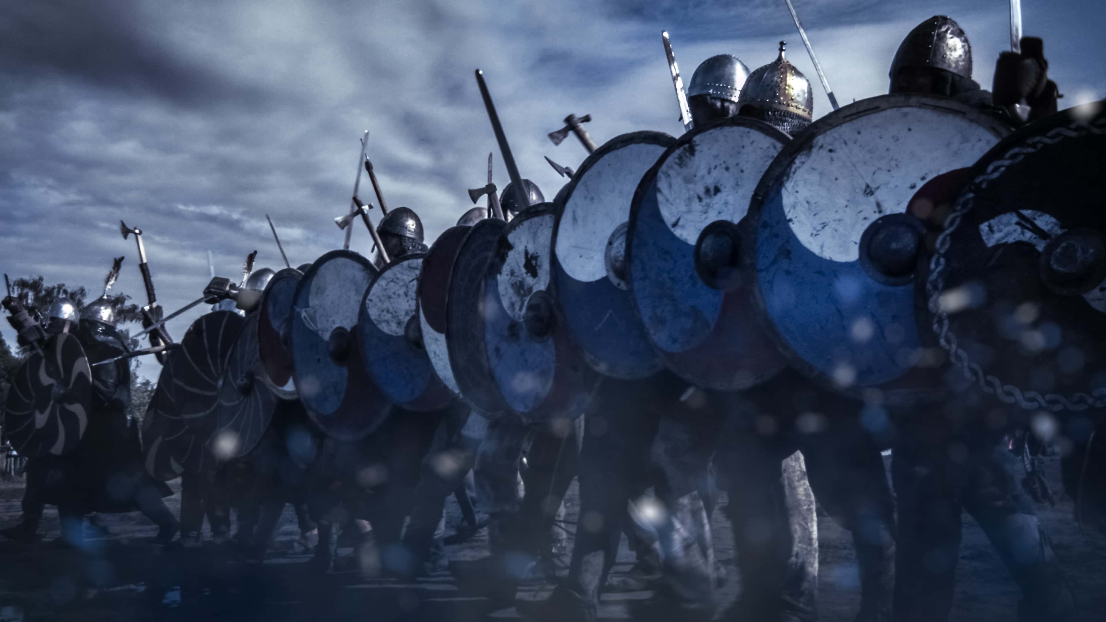 Shot of Advancing Army of Viking Warriors. Medieval Reenactment.