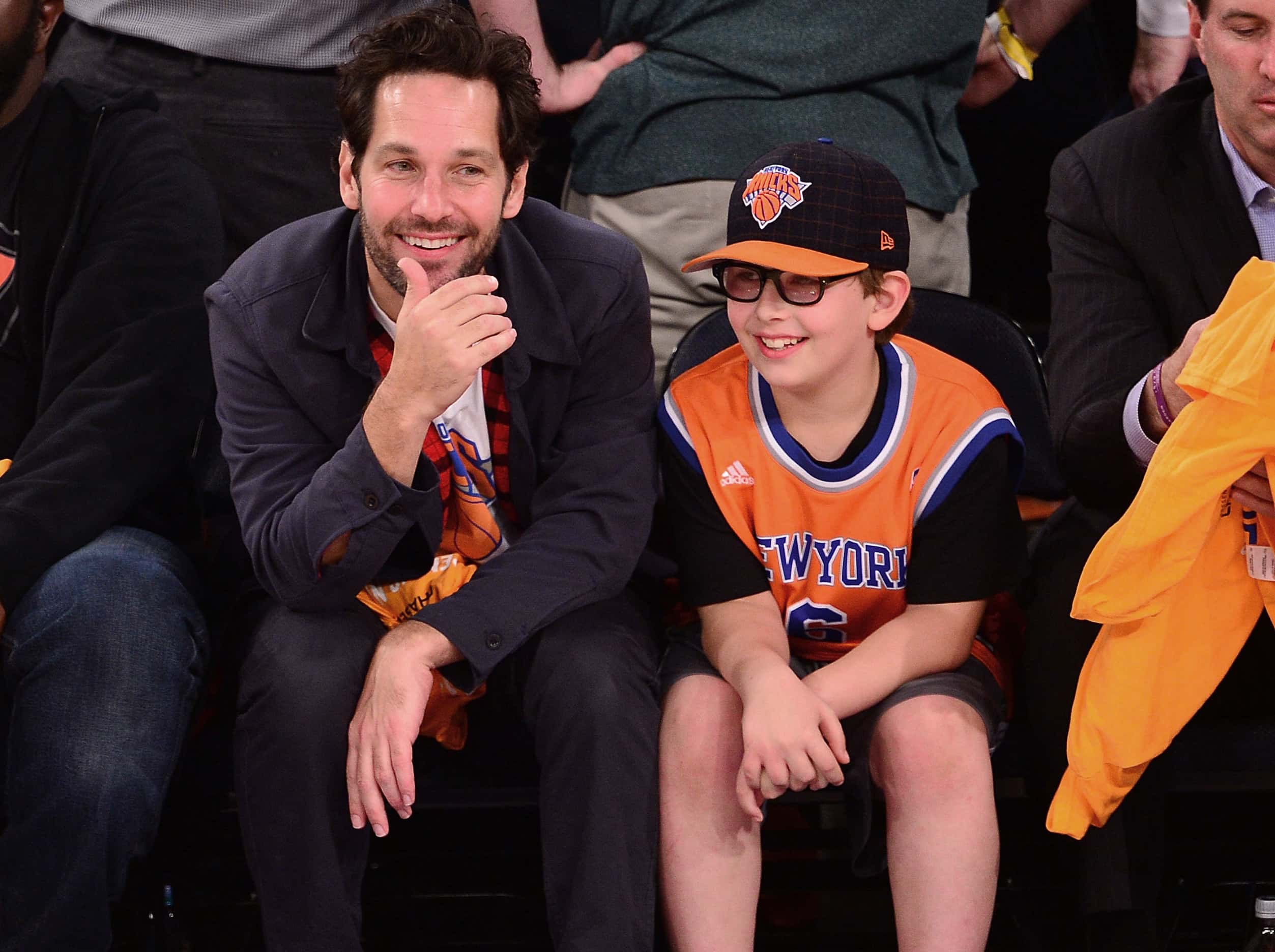 Celebrities Attend The Milwaukee Bucks Vs. The New York Knicks - October 30, 2013. Paul Rudd with his son.