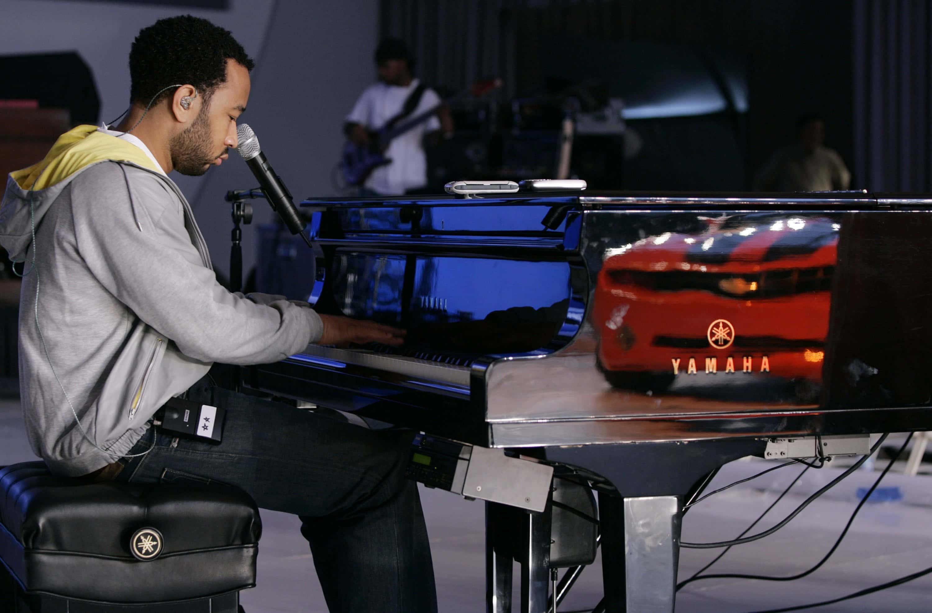 Latest Cars Are Showcased At The Detroit Auto Show. John Legend.