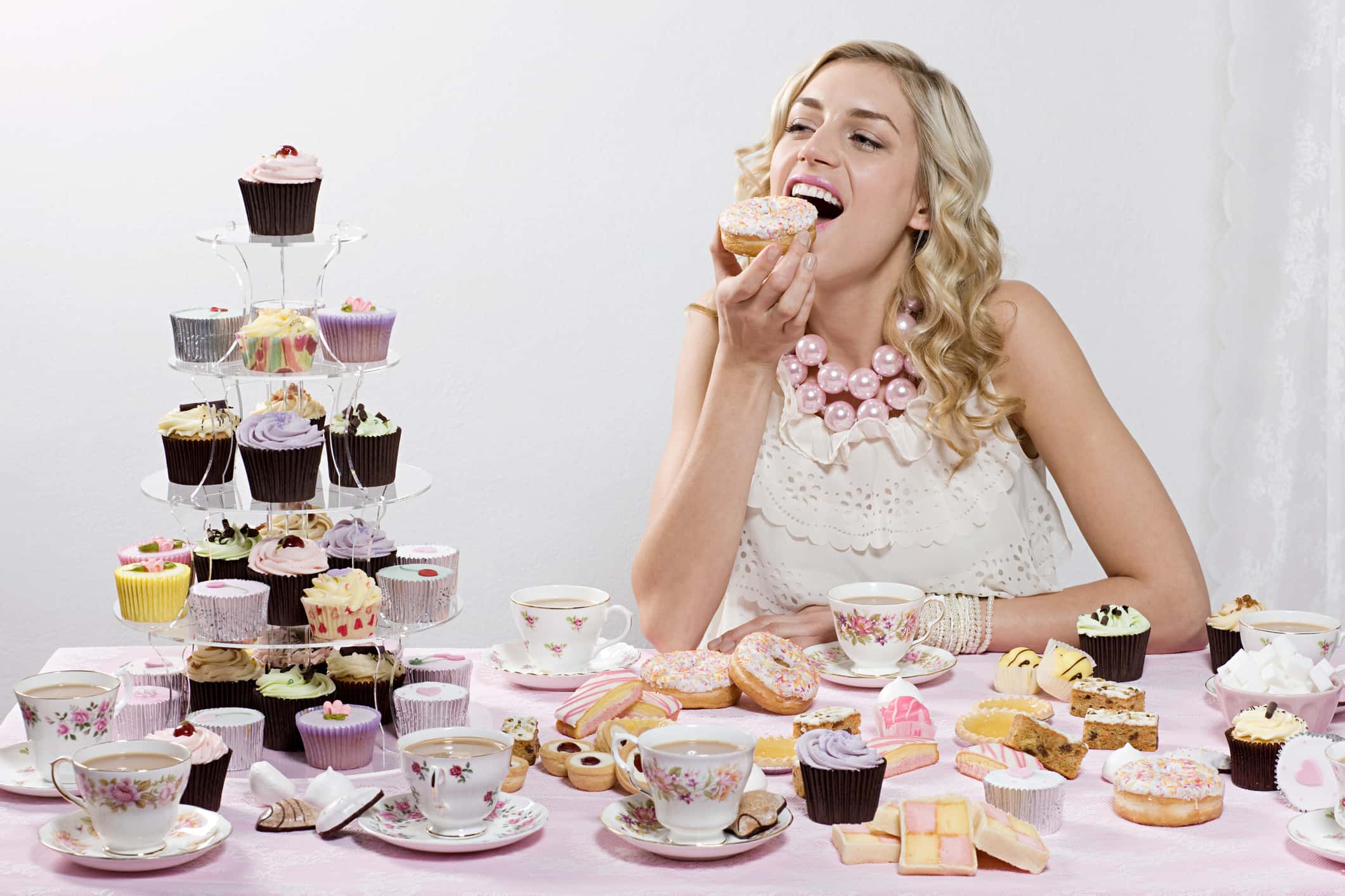 Young Woman Eating Sweets