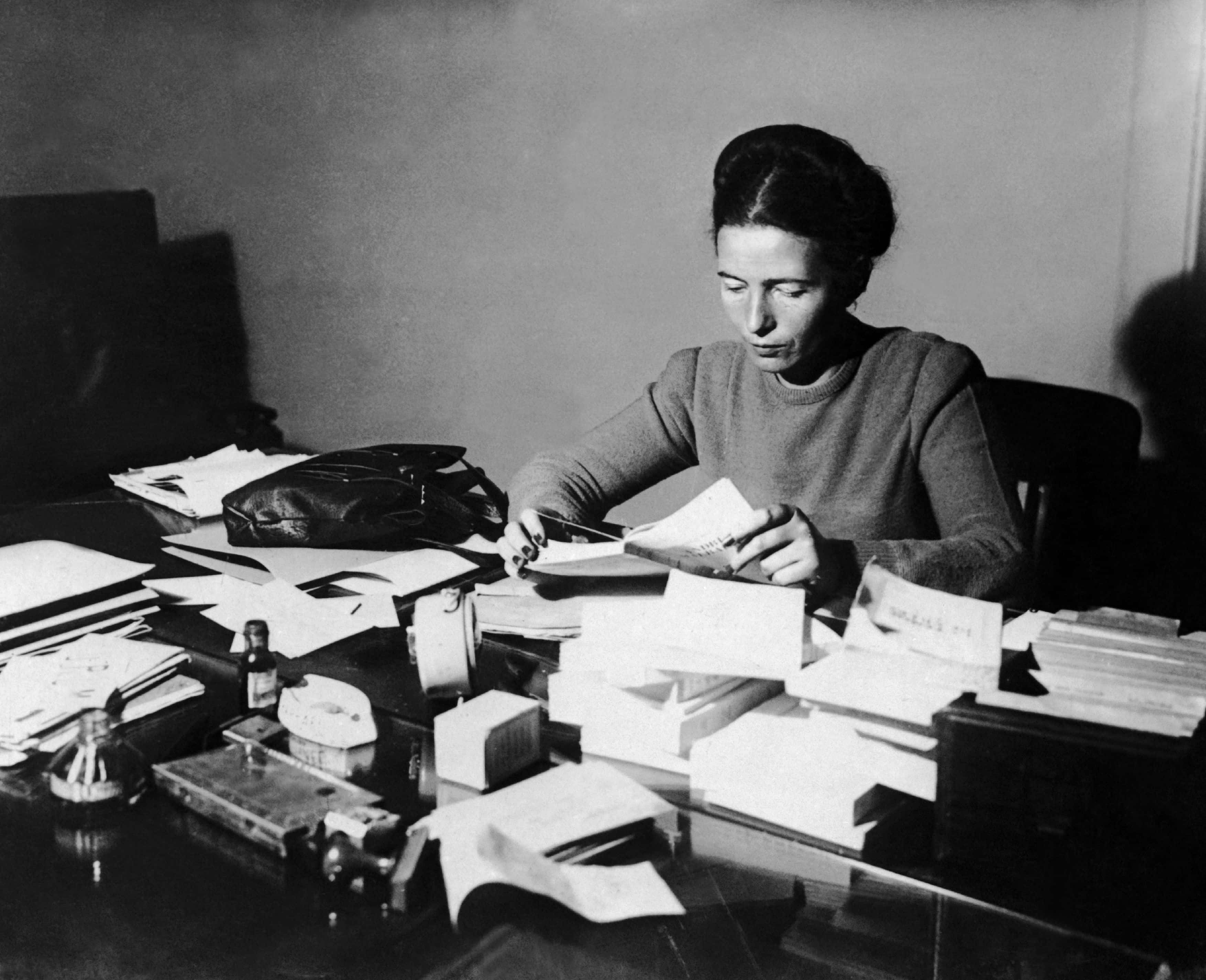 Simone De Beauvoir Reading At Her Desk In 1953.