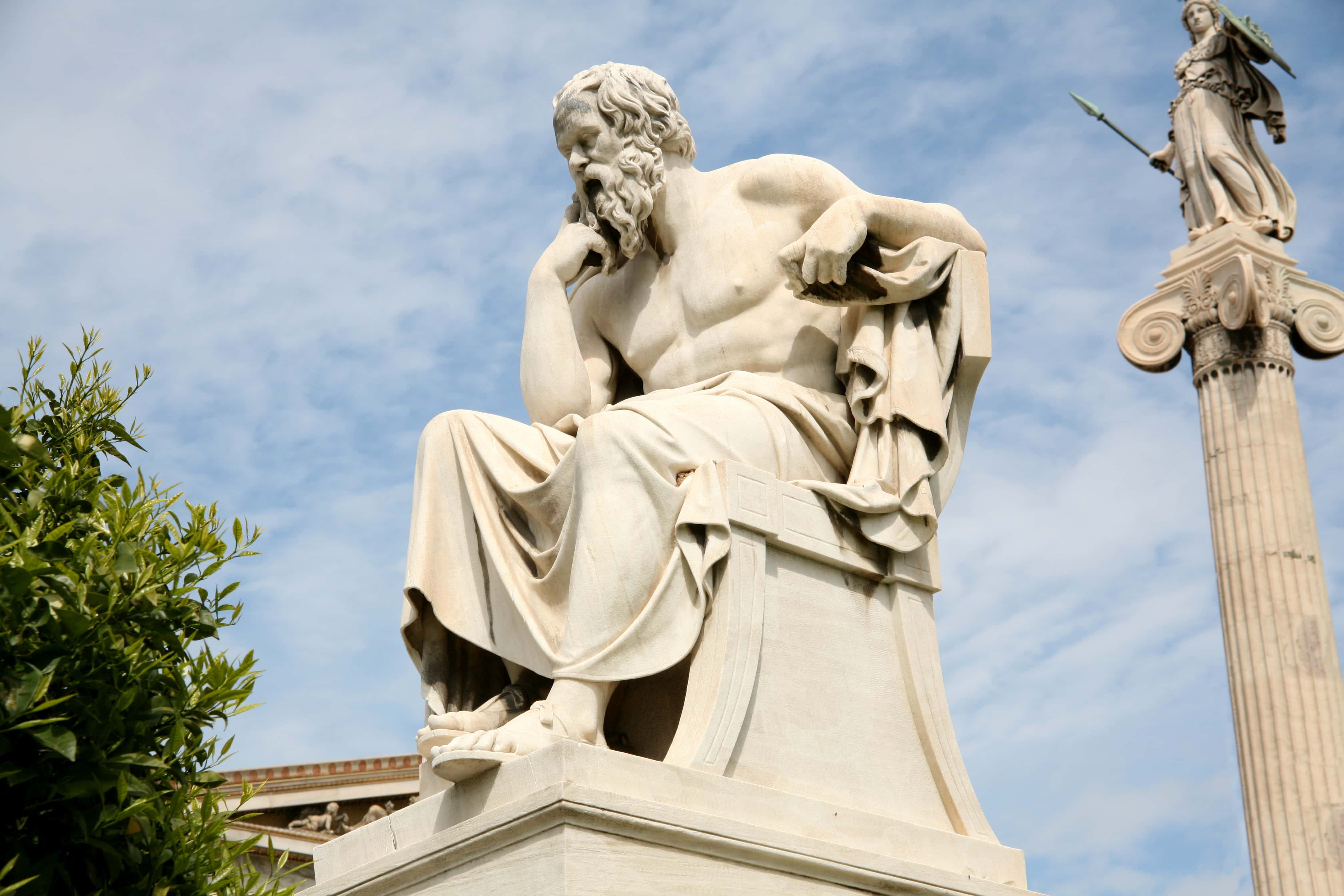 Statue of Socrates, the philosopher, with sky in distance.