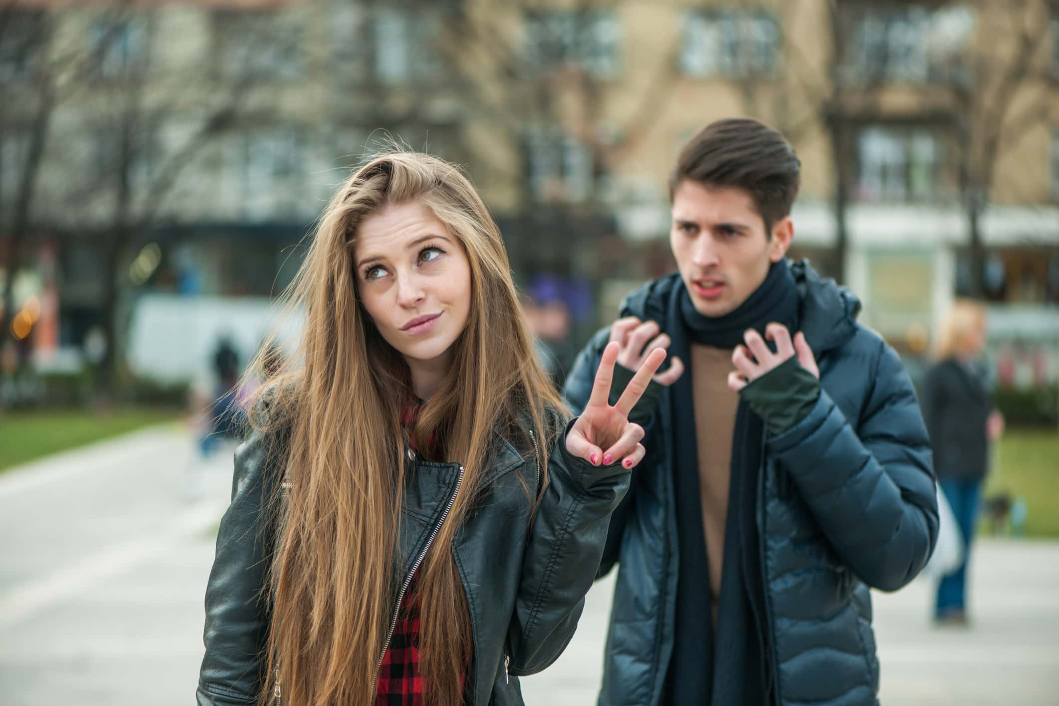 Young couple arguing at the street