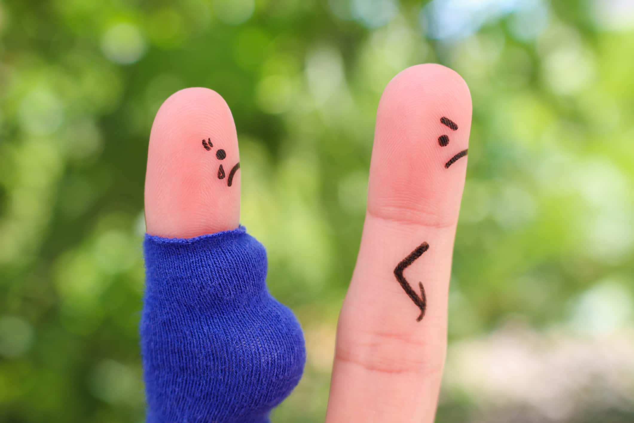 Fingers art of couple during quarrel. Concept the husband left his pregnant wife