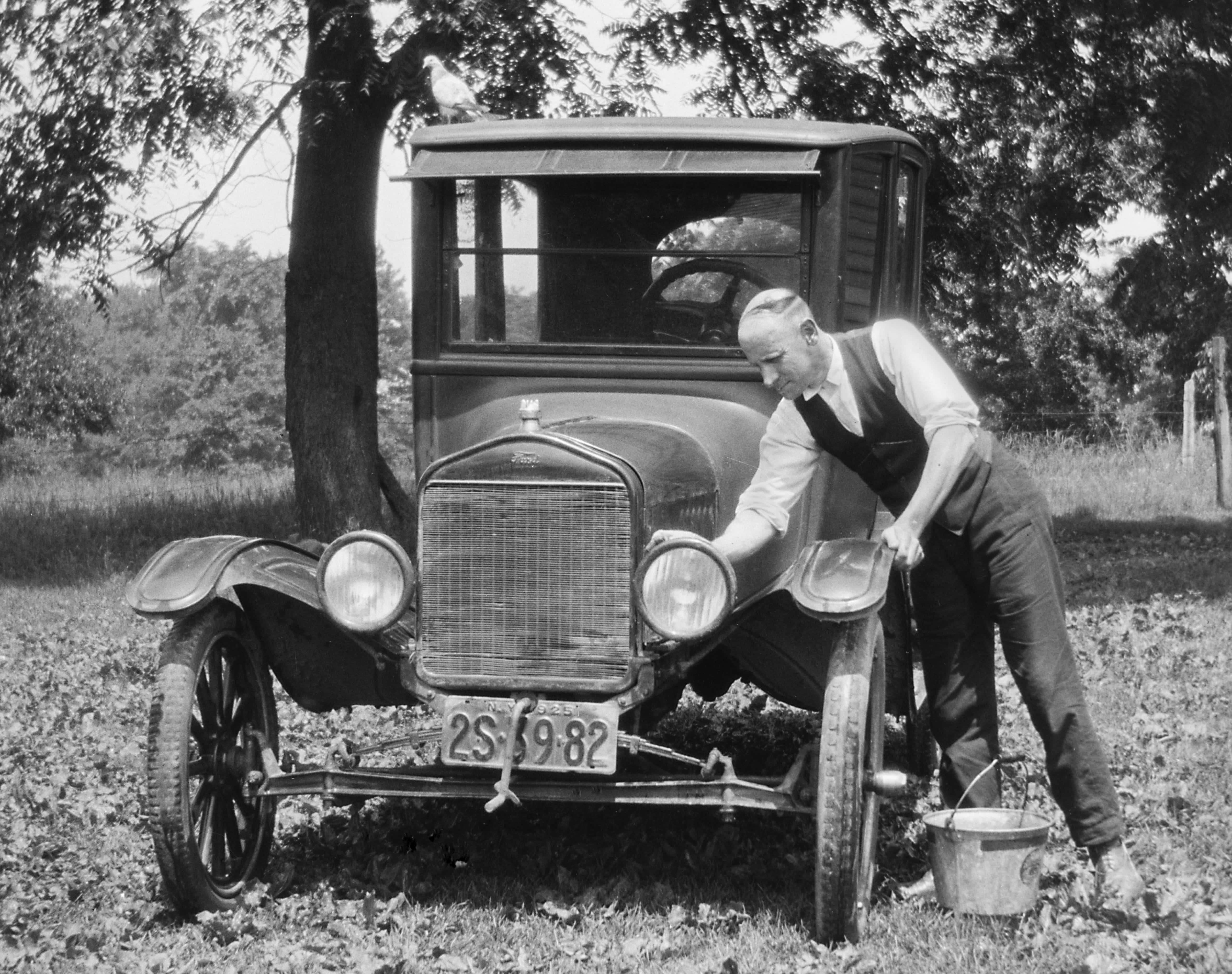 A New York state man washes his Model T. 1925.