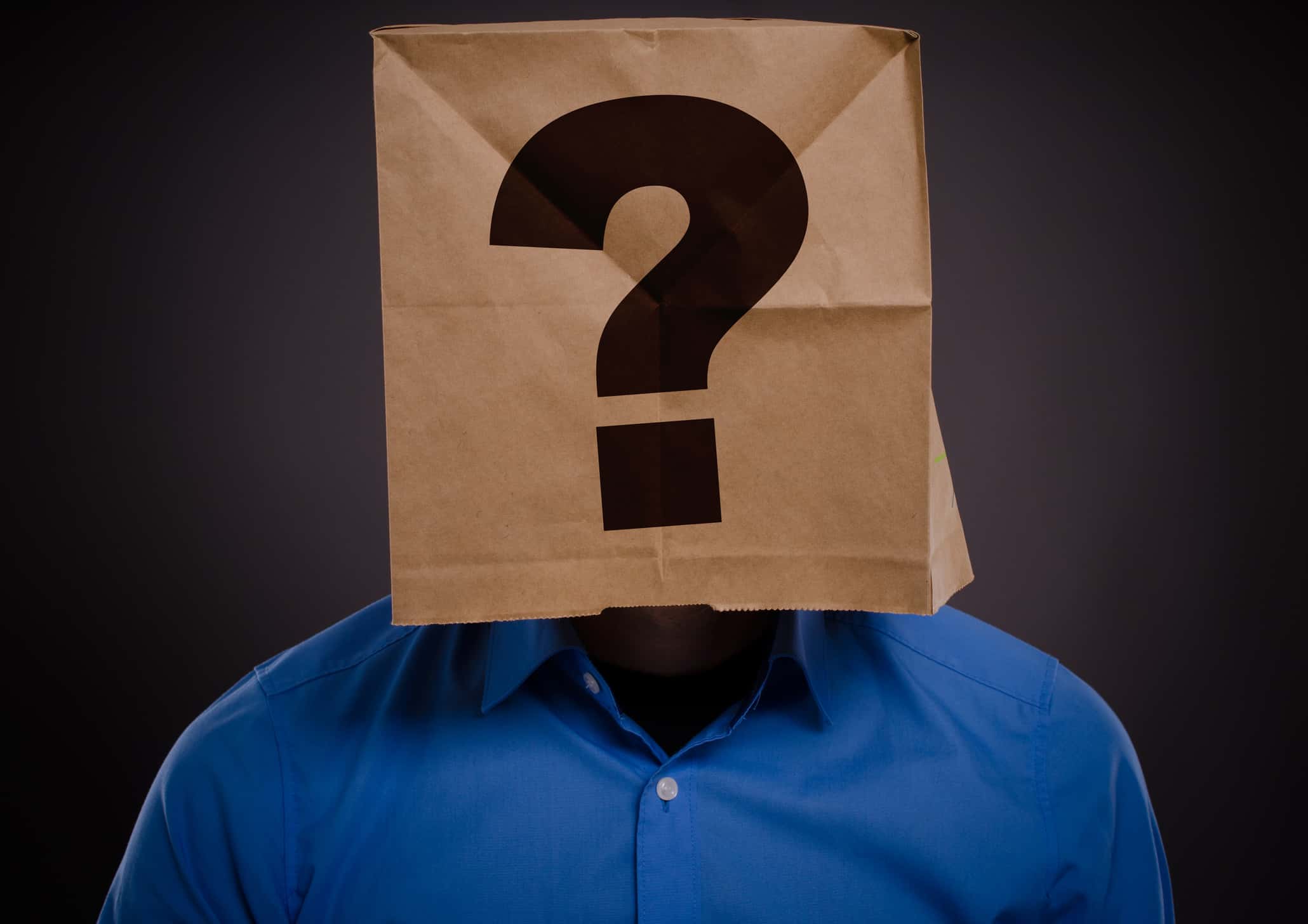 Headshot of man wearing a paper bag above his head.